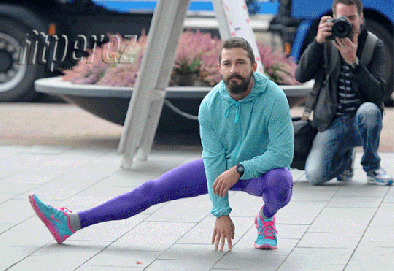 Shia-Labeouf-Dancing-Russian-Style-on-The-Set-Of-a-Movie-Wearing-Purple-Pants
